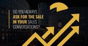 Tall buildings at sunrise with the sun coming up behind them arrows pointing to Do You Always Ask for the Sale in Your Sales Conversations in bold overlay